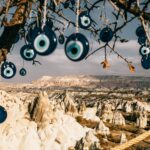 nazar amulets on tree branches near stony formations in cappadocia